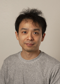 Dr. Kitazawa in a gray shirt on a neutral background