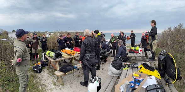 Divers getting instructions at the beach prior to dive
