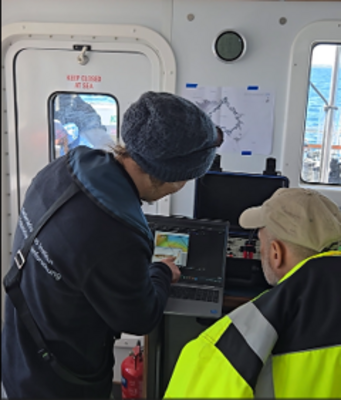 Photo of scientists onboard a vessel