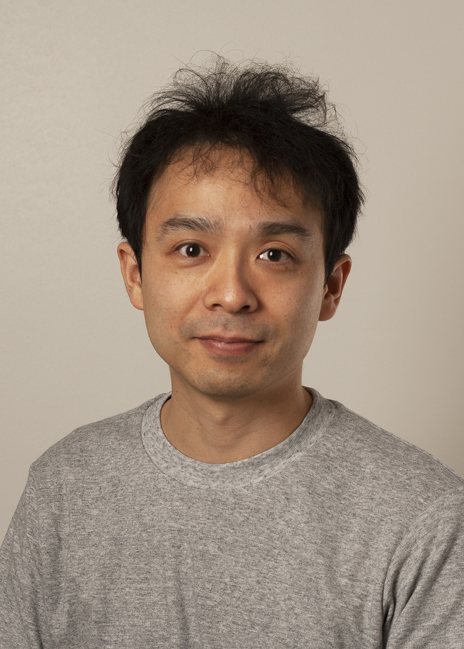Taro in a gray shirt on a light background