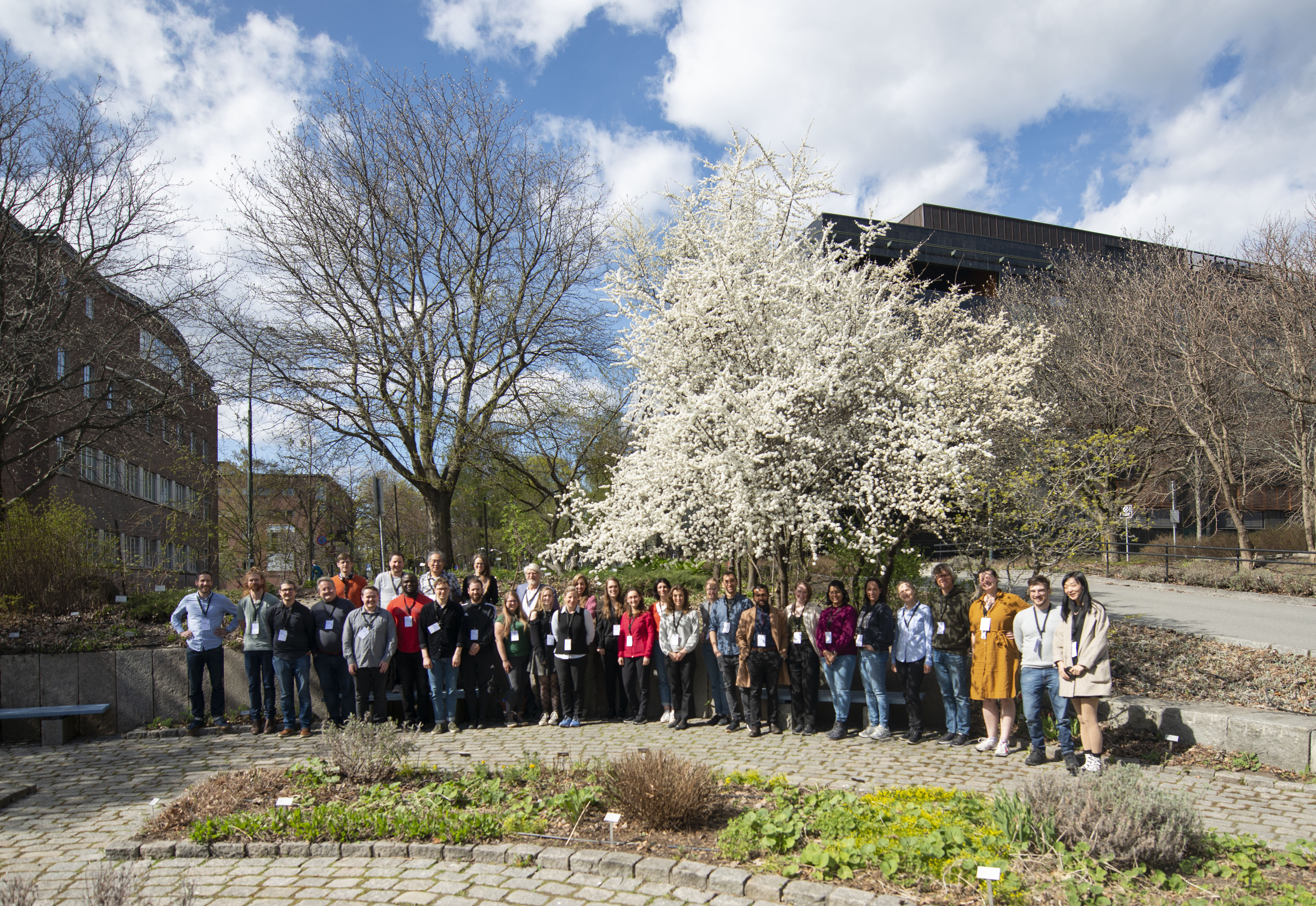 Photo of about 20 people standing outside