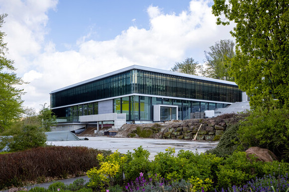 A building with many windows set among trees